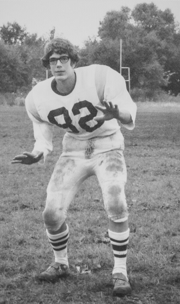 Joe wearing high school football uniform